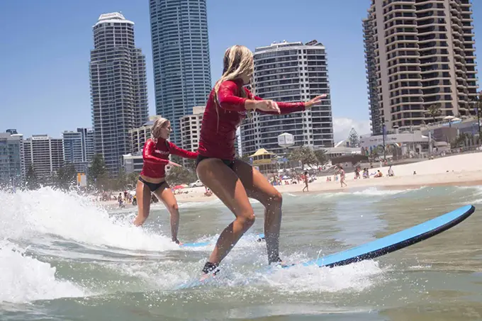 two girls surfing